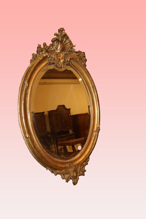 Antica specchiera ovale francese del 1800 in legno dorato foglia oro