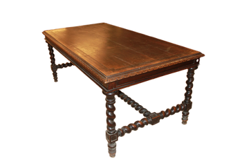 Large French table from the early 19th century in walnut wood with carvings