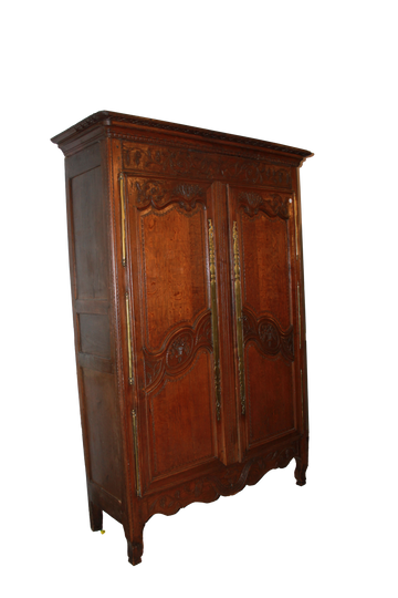 French Normandy wardrobe from the late 1700s with 2 richly carved doors in oak wood