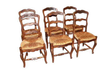 Group of 10 French Provençal style chairs in richly carved walnut wood