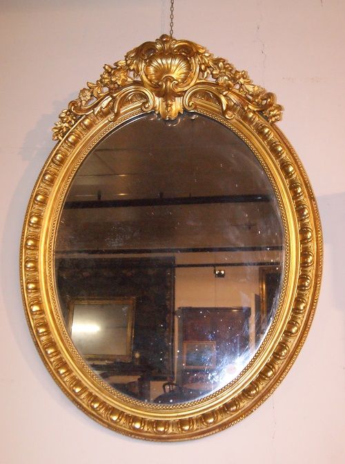 Antica specchiera francese del 1800 dorata ovale verticale Luigi XV