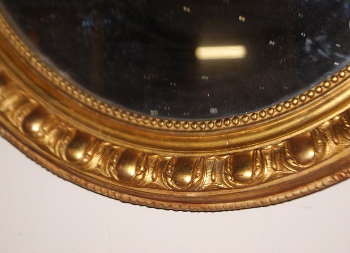 Antica specchiera francese del 1800 dorata ovale verticale Luigi XV